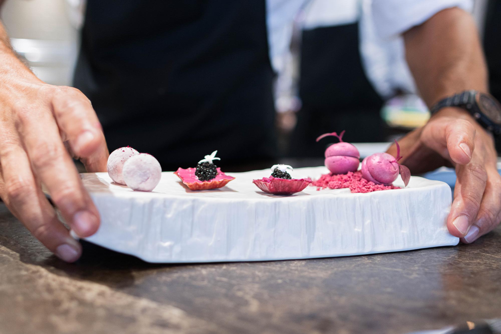 Chef selecting premium ingredients on marble counter