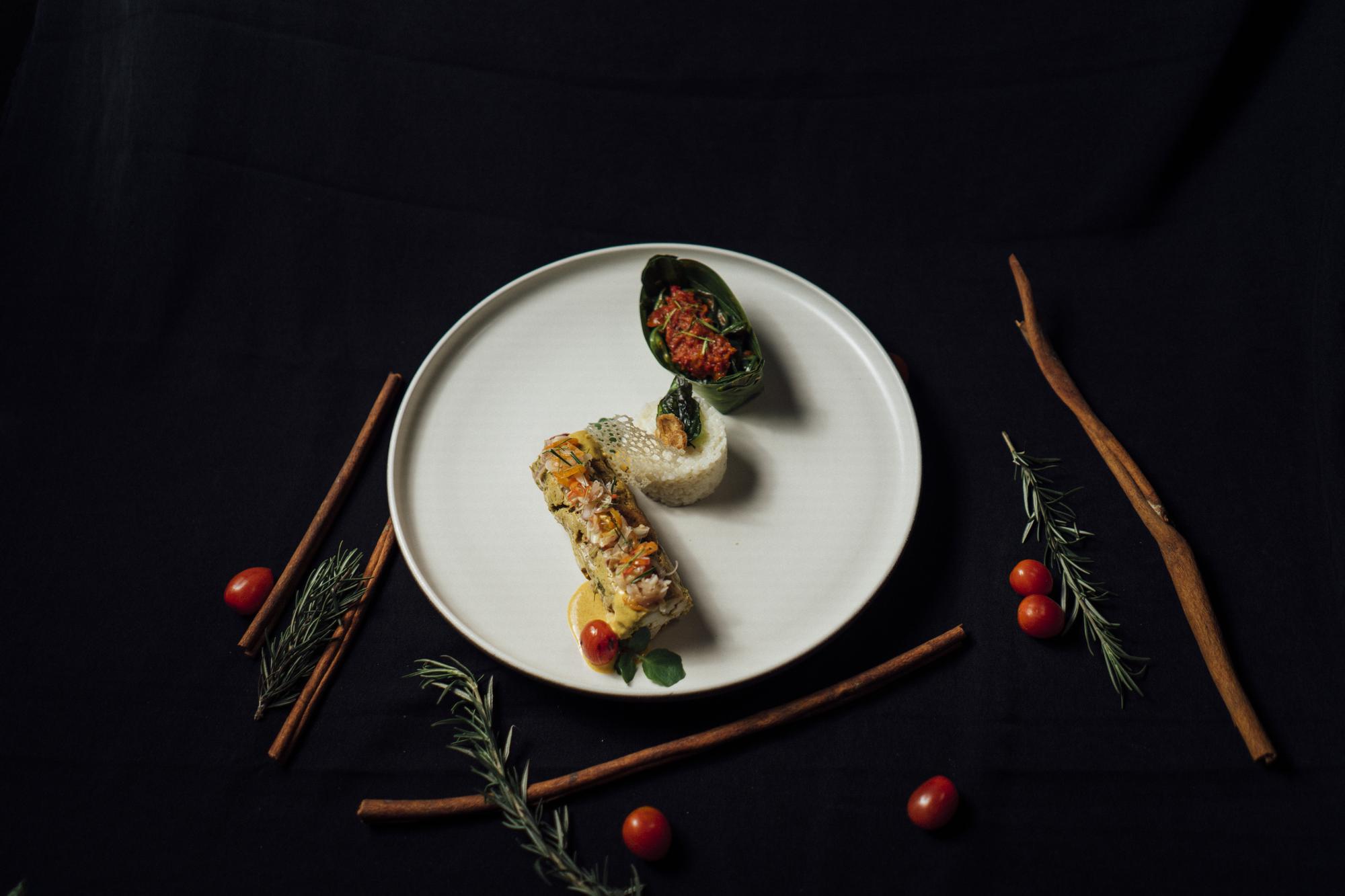 Artfully plated gourmet dish on dark table